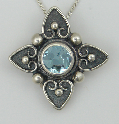 Sterling Silver Gathering of Hearts on This Necklace With Blue Topaz